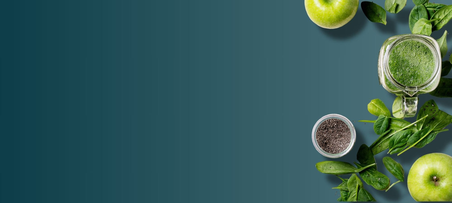 Fresh green ingredients, including apples, spinach, chia seeds, and a green smoothie representing the natural, nutrient-rich elements found in E3Live Superfoods products, supporting overall health and wellness.